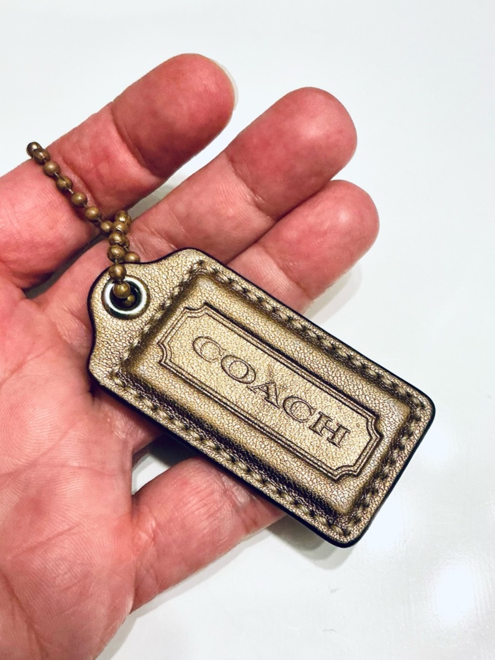 COACH Metallic Bronze, Gold Finish Replacement Hang Tag Bag Charm Fob